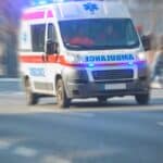 Paramedic 911 ambulance car running fast through the big city. Paramedic 911 ambulance car running fast through the big city.